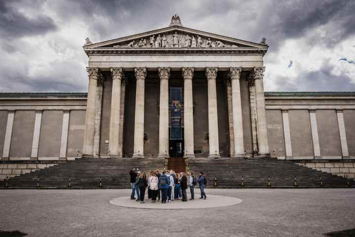 a group of people standing in front of a building