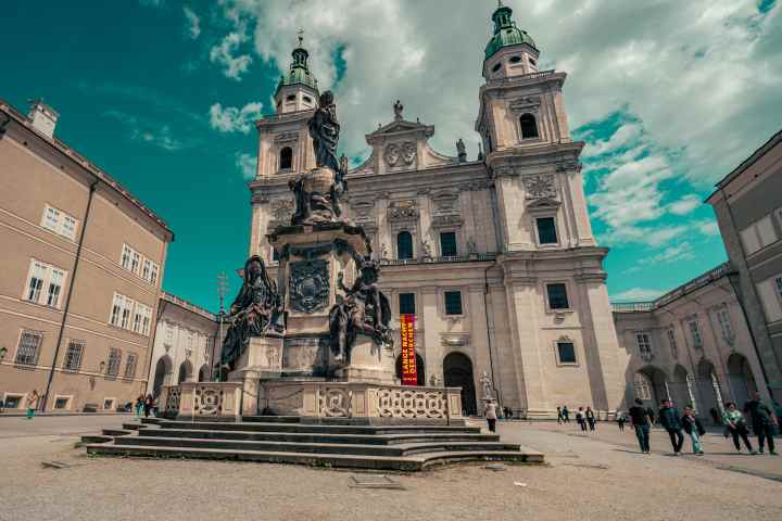 a castle with a clock tower in front of a building