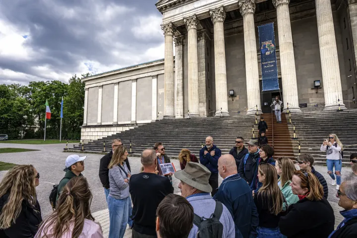a group of people standing in front of a building