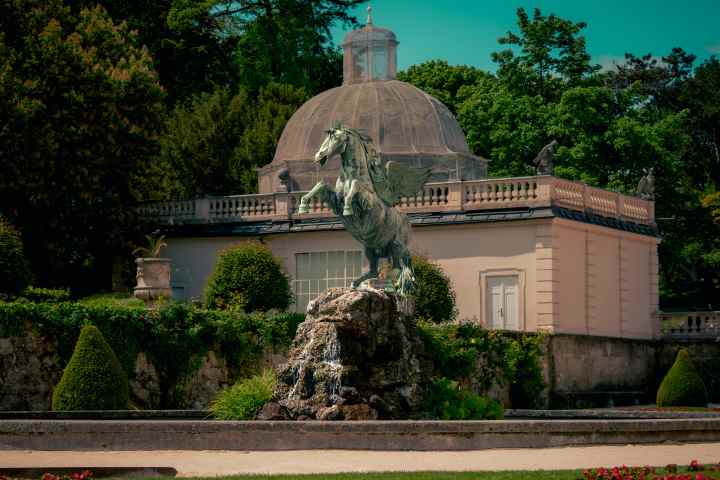 a house with bushes in front of a building