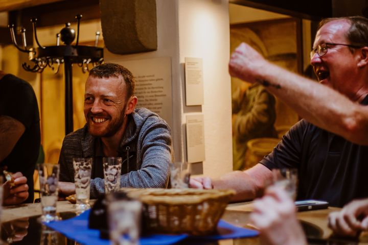 a group of people sitting at a table
