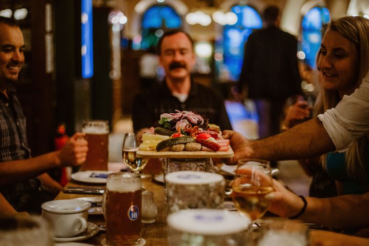 a man standing in front of a cake