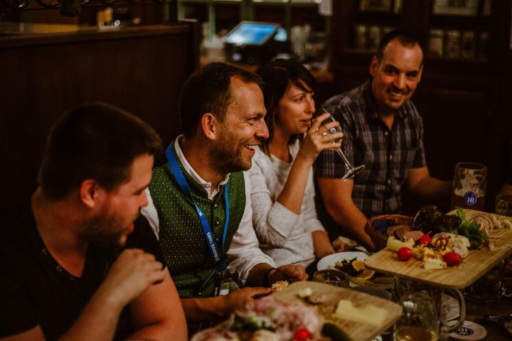 a man sitting at a table eating pizza