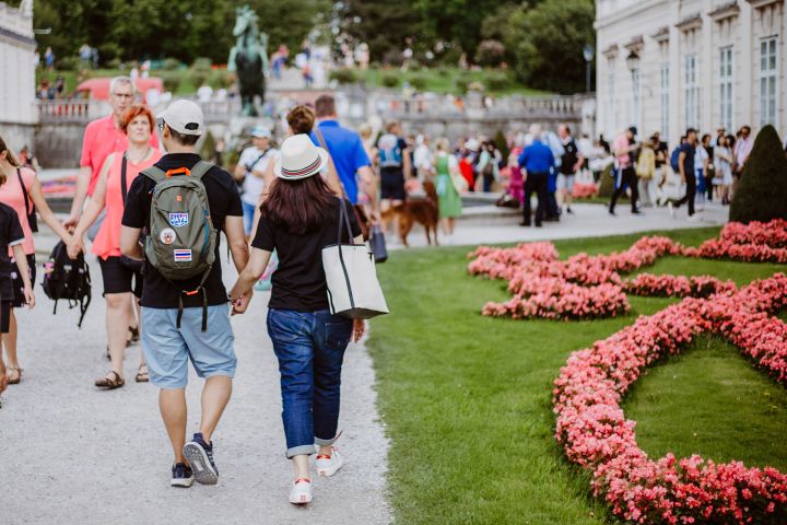 a group of people walking in the grass