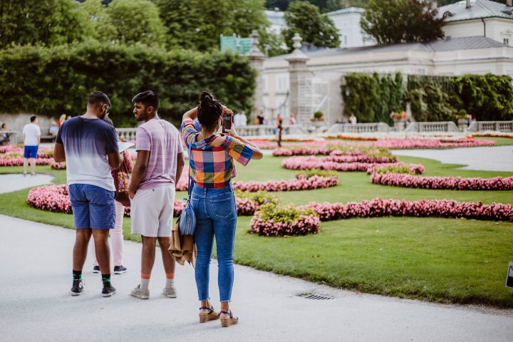 a group of people standing in a park