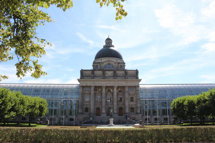 a large clock tower in front of a building