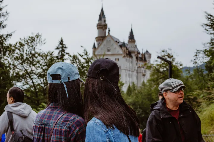 a group of people standing outside of a building