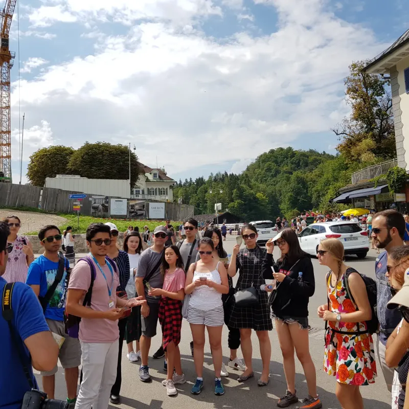 a group of people standing in front of a building